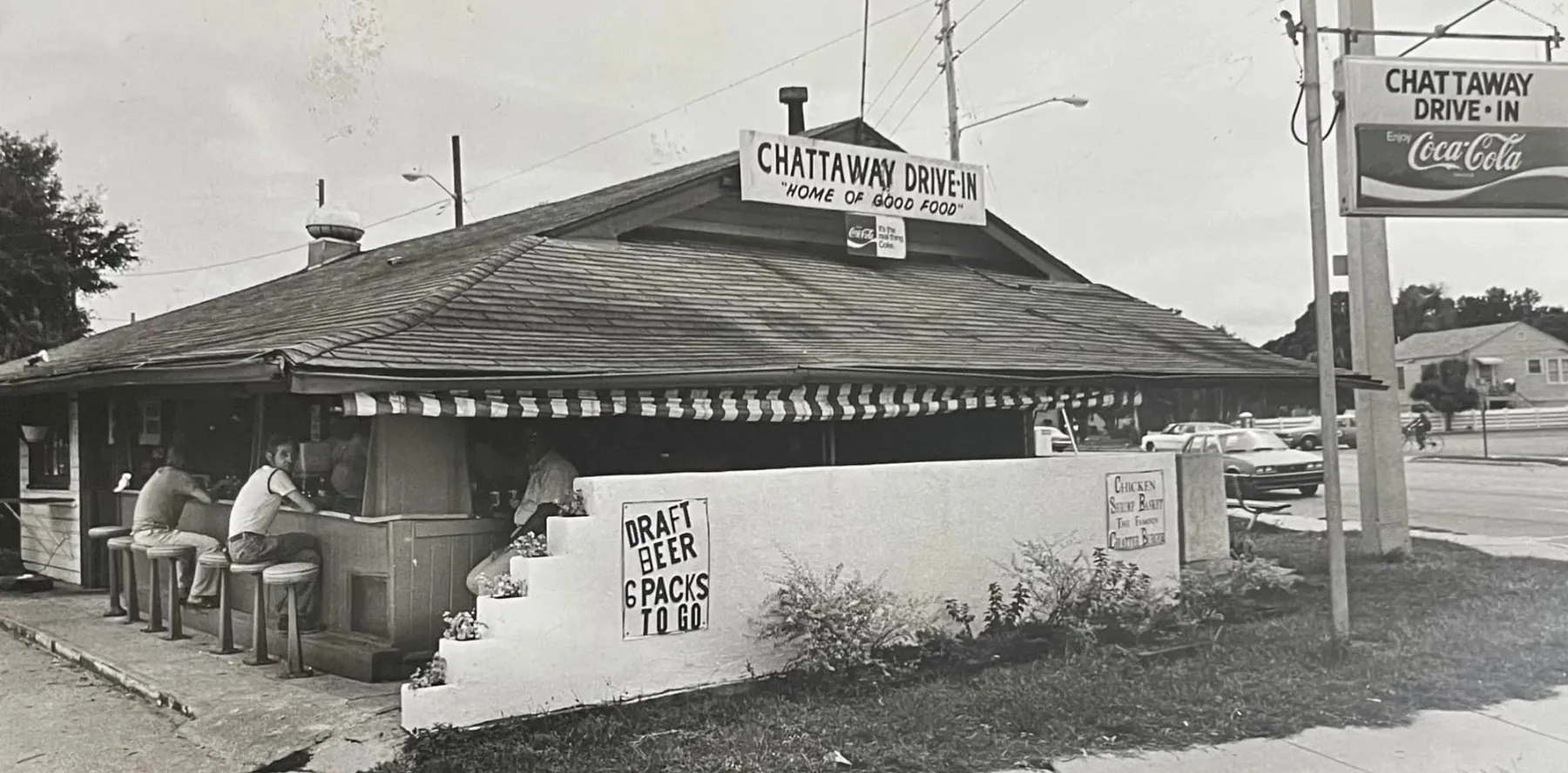 Black-and-white image of the Chattaway Drive-In exterior and roadside sign.